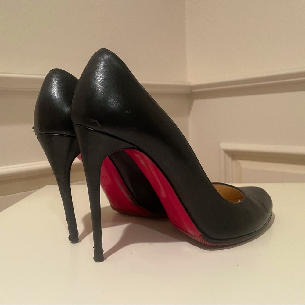 Christian Louboutin Black Leather round toe pumps
